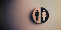 Toiletskilt med mand og kvinde